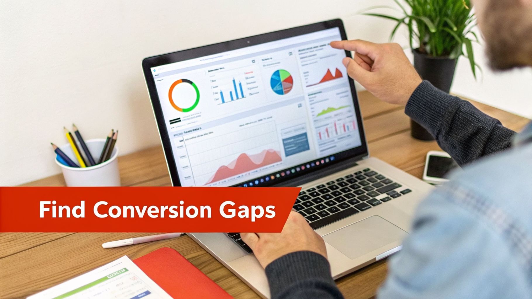 Person analyzing business data and charts on a laptop, pointing at a graph to identify conversion gaps.