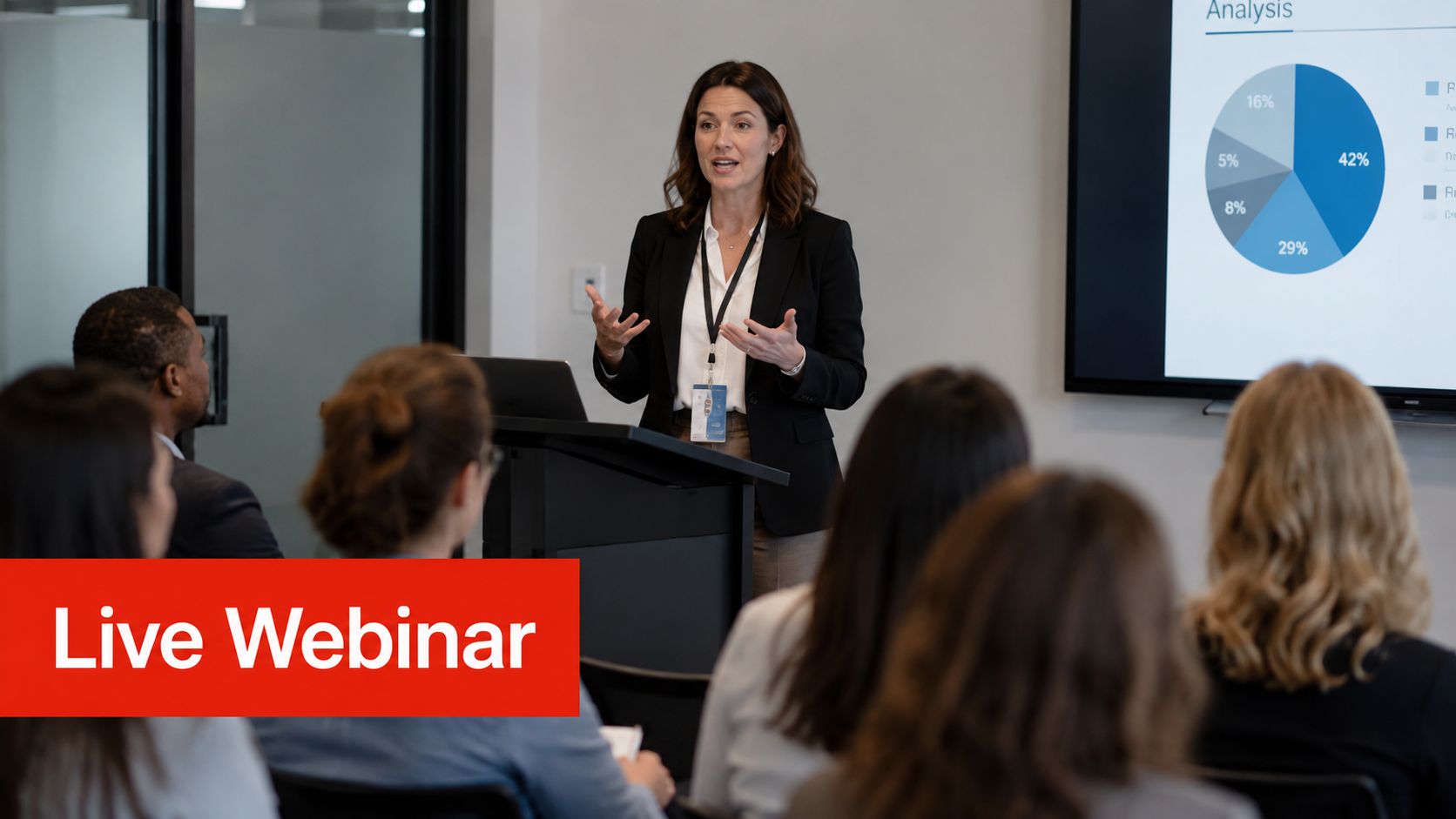 A professional woman delivers a presentation about sales funnel analysis to an audience in a corporate meeting room.